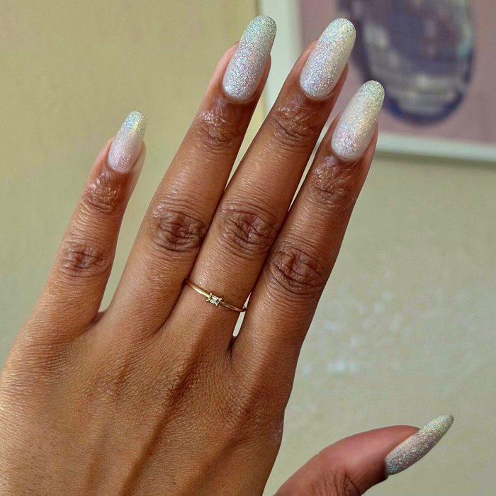 Glitter Department ultra fine holographic silver polish on natural nails for a shimmering at home manicure look by Olive and June