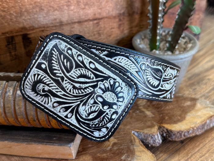 Black tooled cowhide belt, detailed floral panel and contrast-stitched edges