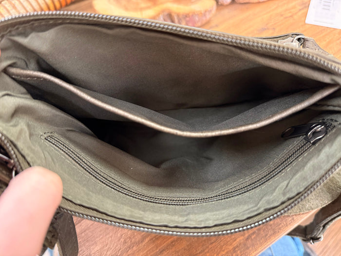 Dark olive leather crossbody purse interior with zip pocket and smooth fabric lining