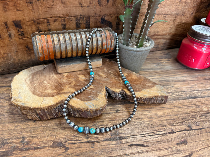 Sterling silver Kingman turquoise necklace with graduated blue stones and silver beadwork