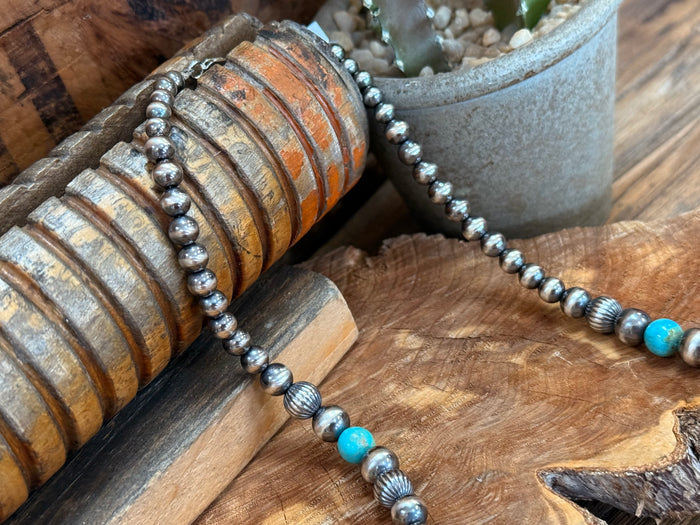 Sterling silver Kingman turquoise necklace with blue accent bead stations and heishi links