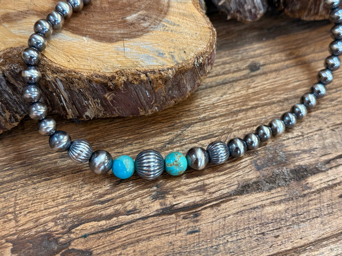 Sterling silver turquoise bead necklace with alternating blue stones and textured silver rounds