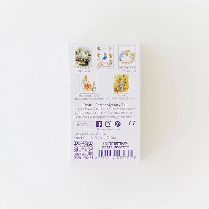The back of a white 'Beatrix Potter Mystery Box' package, featuring illustrations of five classic stories on a clean white background.