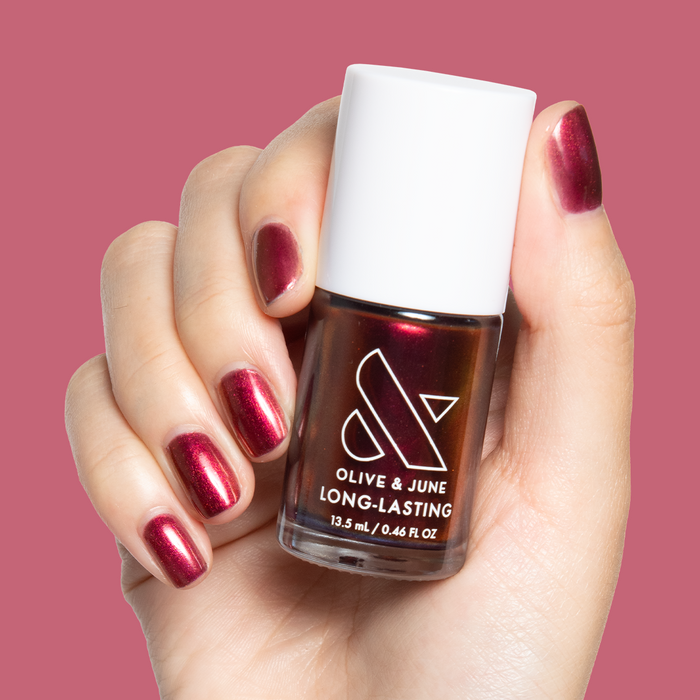 Budget? What Budget deep rose-orange duochrome polish on natural nails for a long-lasting mani by Olive and June
