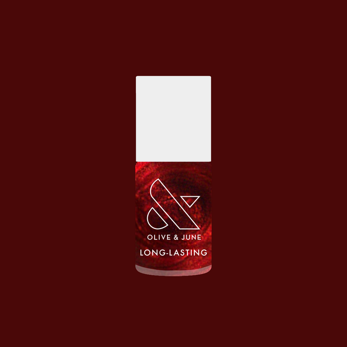 Budget? What Budget deep rose-orange duochrome gel polish bottle for a long-lasting mani by Olive and June