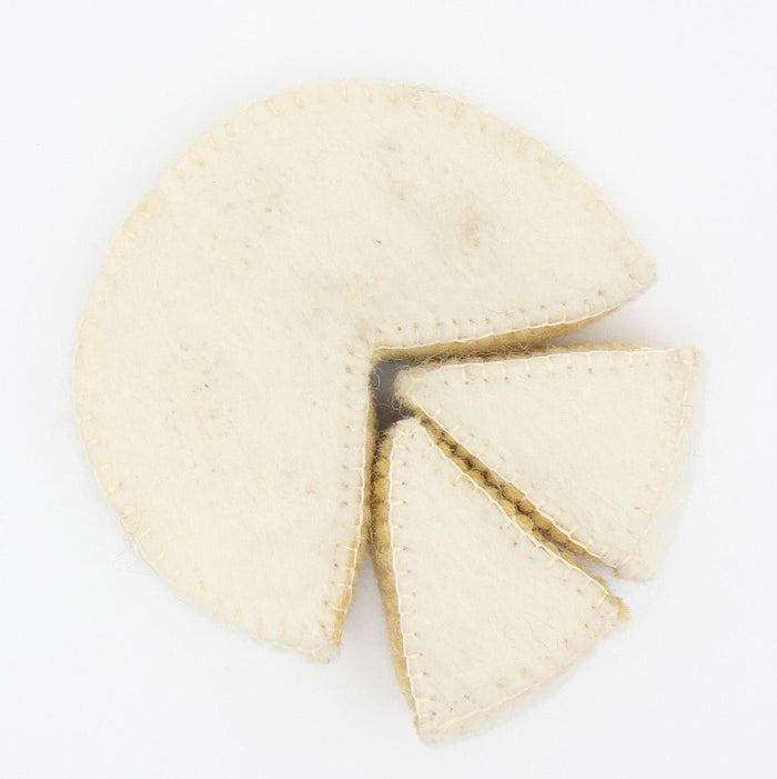 Topdown view of felt camembert cheese and two wedges on a white background