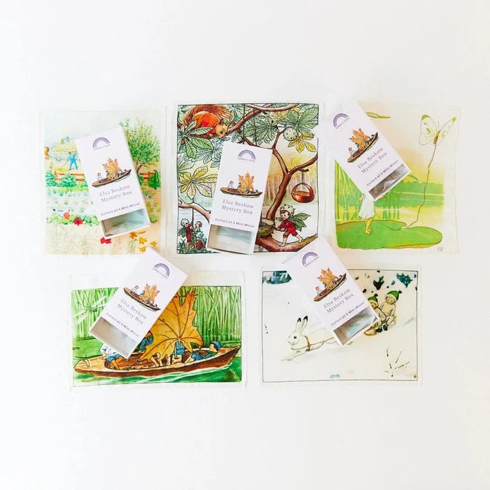 Five illustrated mystery box cards arranged on a white background, each with a small hanging card labeled 'Elsa Beskow Mystery Box' and a corresponding illustrated envelope behind it.