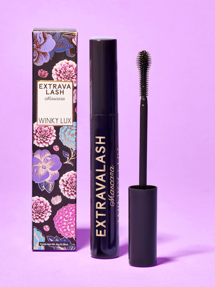 extravalash mascara and box standing with purple background