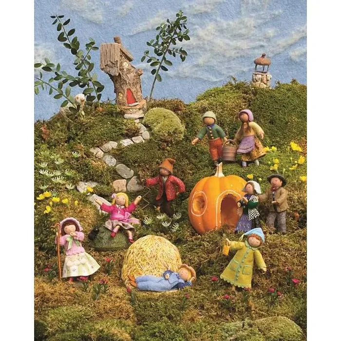 Illustration of children playing in a fantasy garden with pumpkins and fairy tale elements.