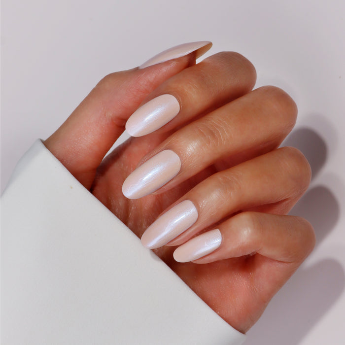 A hand with neatly manicured nails painted in LONDONTOWN’s Get Well Nail Recovery, offering a soft, pearly white finish ideal for those rehabilitating damaged nails.
