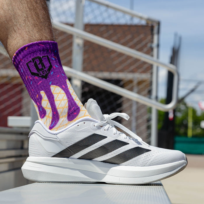 Adult model wearing multi-color socks with "Ice Cream Performance  3-Pack" design