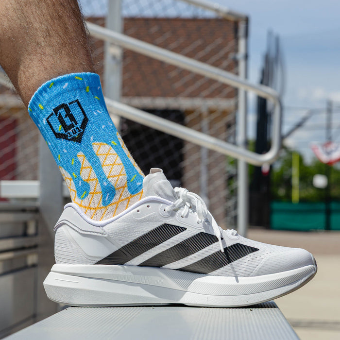 Adult model wearing multi-color socks with "Ice Cream Performance  3-Pack" design