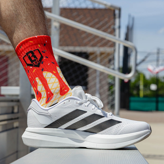 Adult model wearing multi-color socks with "Ice Cream Performance  3-Pack" design