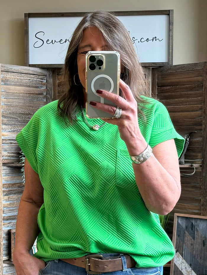 Kelly green textured T-shirt with crew neck and short sleeves, side-front view