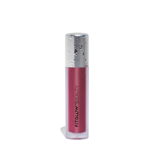 A tube of Fitglow Beauty lip color serum  in shade 'Bloom'- a dark, jewel toned pink