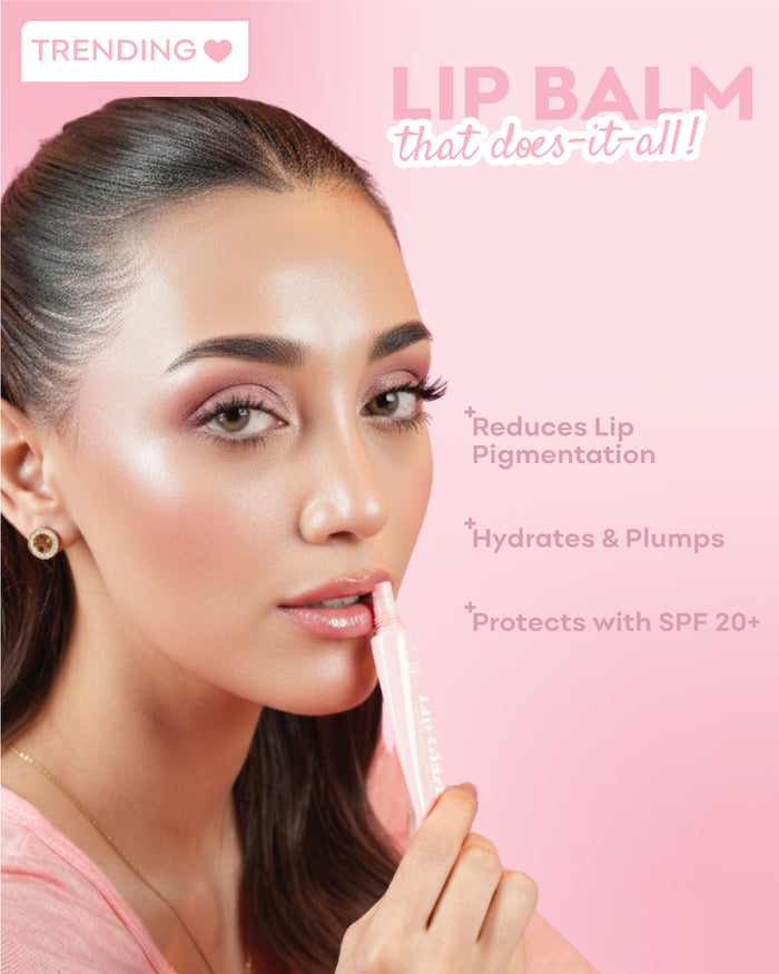 Woman applying lip balm with text on a pink background