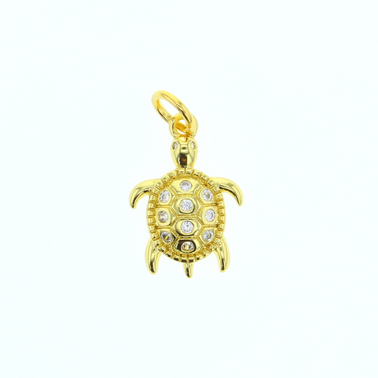 Gold-tone sea turtle CZ charm with clear gemstone eyes and ring bail