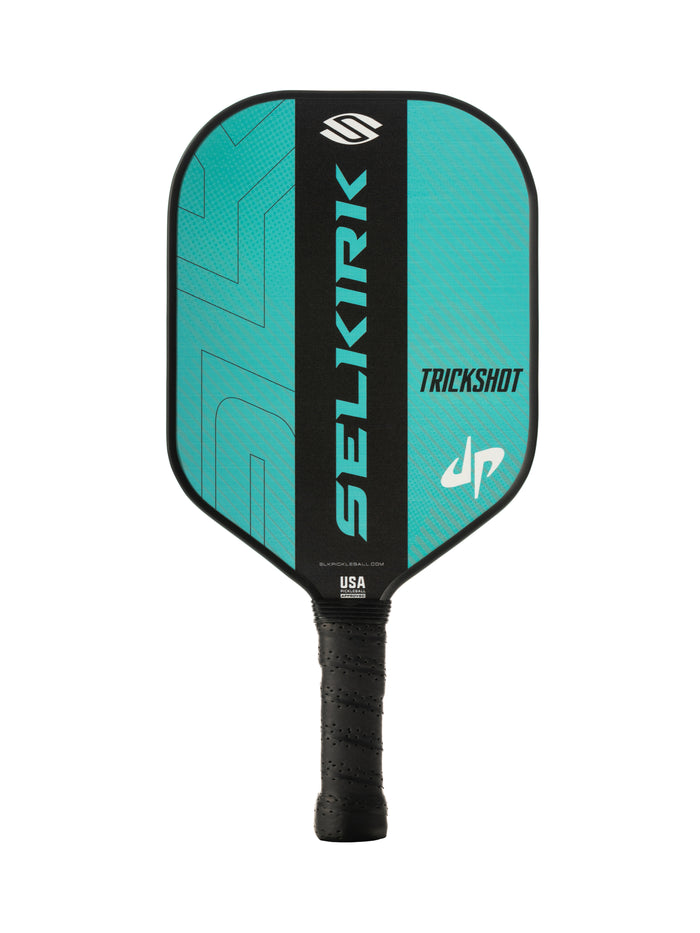 Turquoise and black SELKIRK TRICKSHOT pickleball paddle with textured grip and USA and selkirk.com markings.