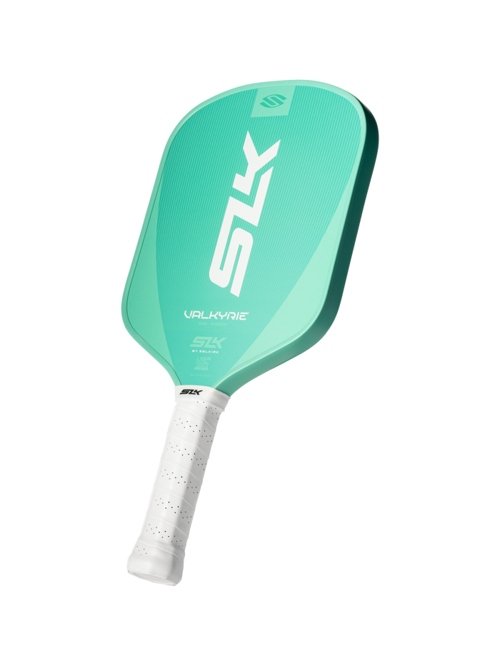 Angled view of Valkyrie pickleball paddle showcasing jade-green textured face, white perforated grip, and SLK logo on a dark background