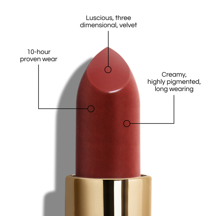 True Velvet Lip Colour bullet close-up, with text demonstrating it's benefits: Lucious, three dimensional, velvet. 10-hour proven wear. Creamy, highly pigmented, long wearing. In shade Enchantment.