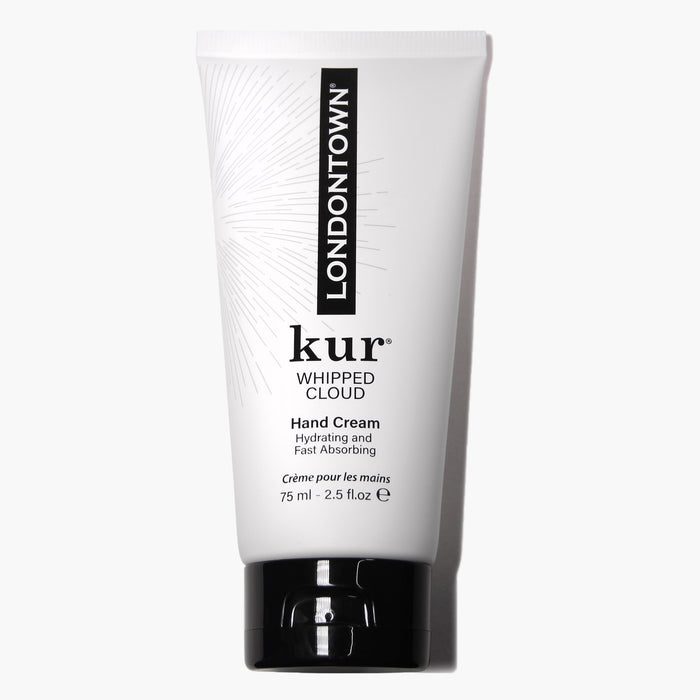 A white tube labeled "Whipped Cloud Hand Cream" by LONDONTOWN, containing 75 ml (2.5 fl oz) of product, designed as a hydrating hand cream with nourishing emollients for fast absorption.