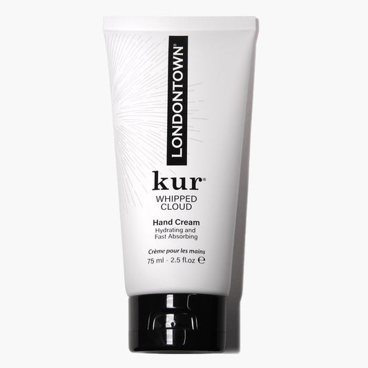 A white tube labeled "Whipped Cloud Hand Cream" by LONDONTOWN, containing 75 ml (2.5 fl oz) of product, designed as a hydrating hand cream with nourishing emollients for fast absorption.