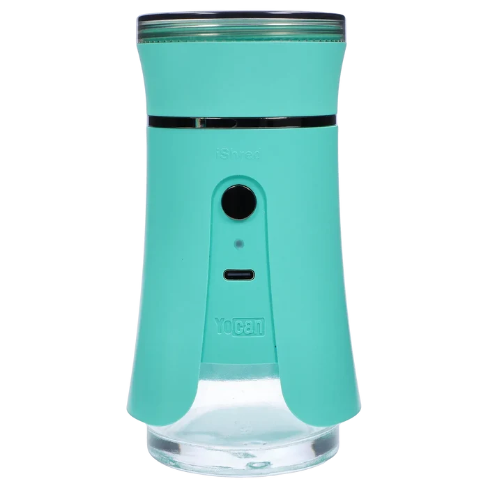 Close-up front view of the green Yocan iShred Electronic Grinder showing its circular power button, USB-C port, and clear lower chamber.