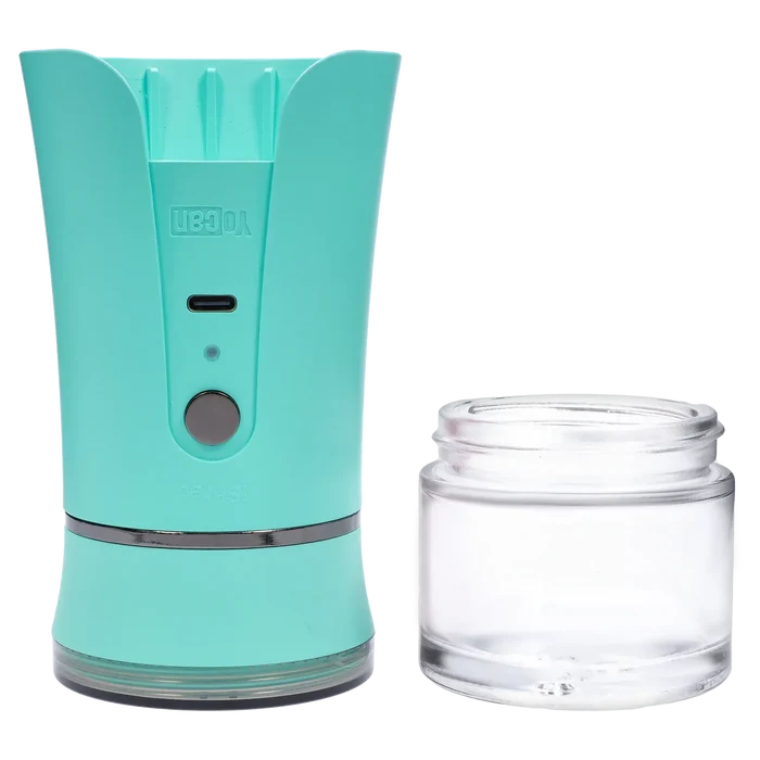 Close-up front view of the green Yocan iShred Electronic Grinder showing its rounded top, power button and clear removable jar.
