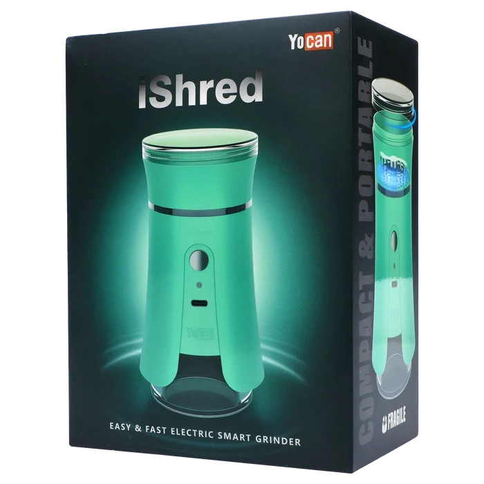Angled front view of the green Yocan iShred Electronic Grinder on its dark branded packaging, lit with a soft teal glow.